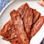 baked turkey bacon on a plate with text on the image