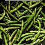 String beans in air fryer after they are cooked with text on the image