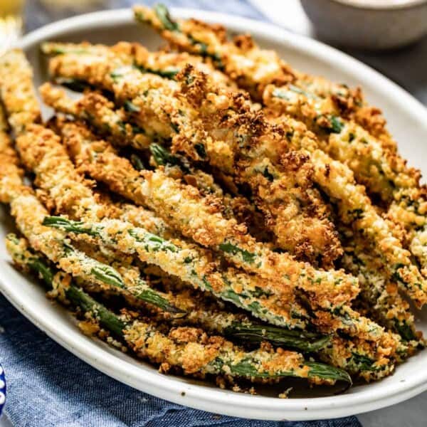 air fryer green bean fries on a plate from the front view