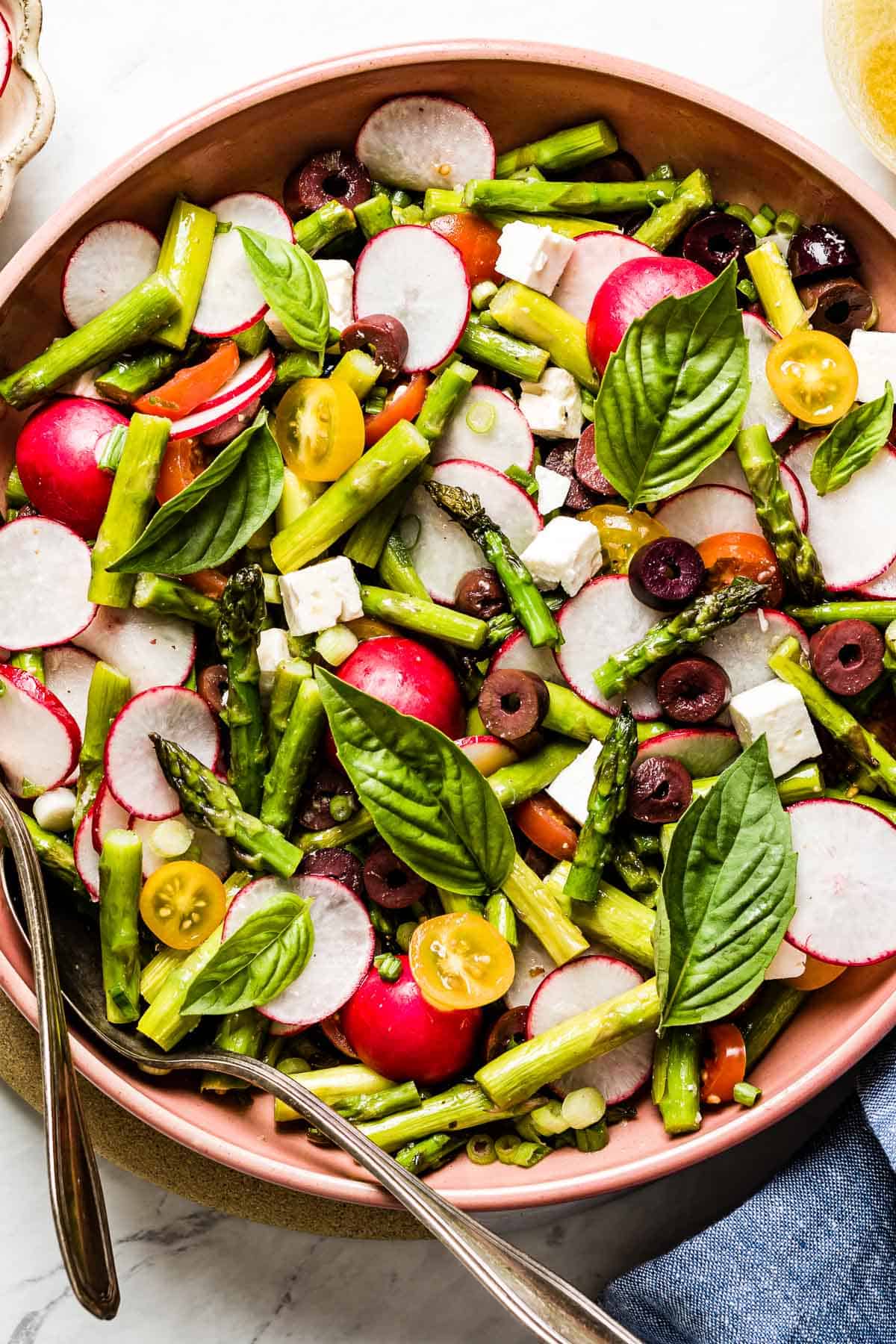 spring green salad with asparagus in a bowl