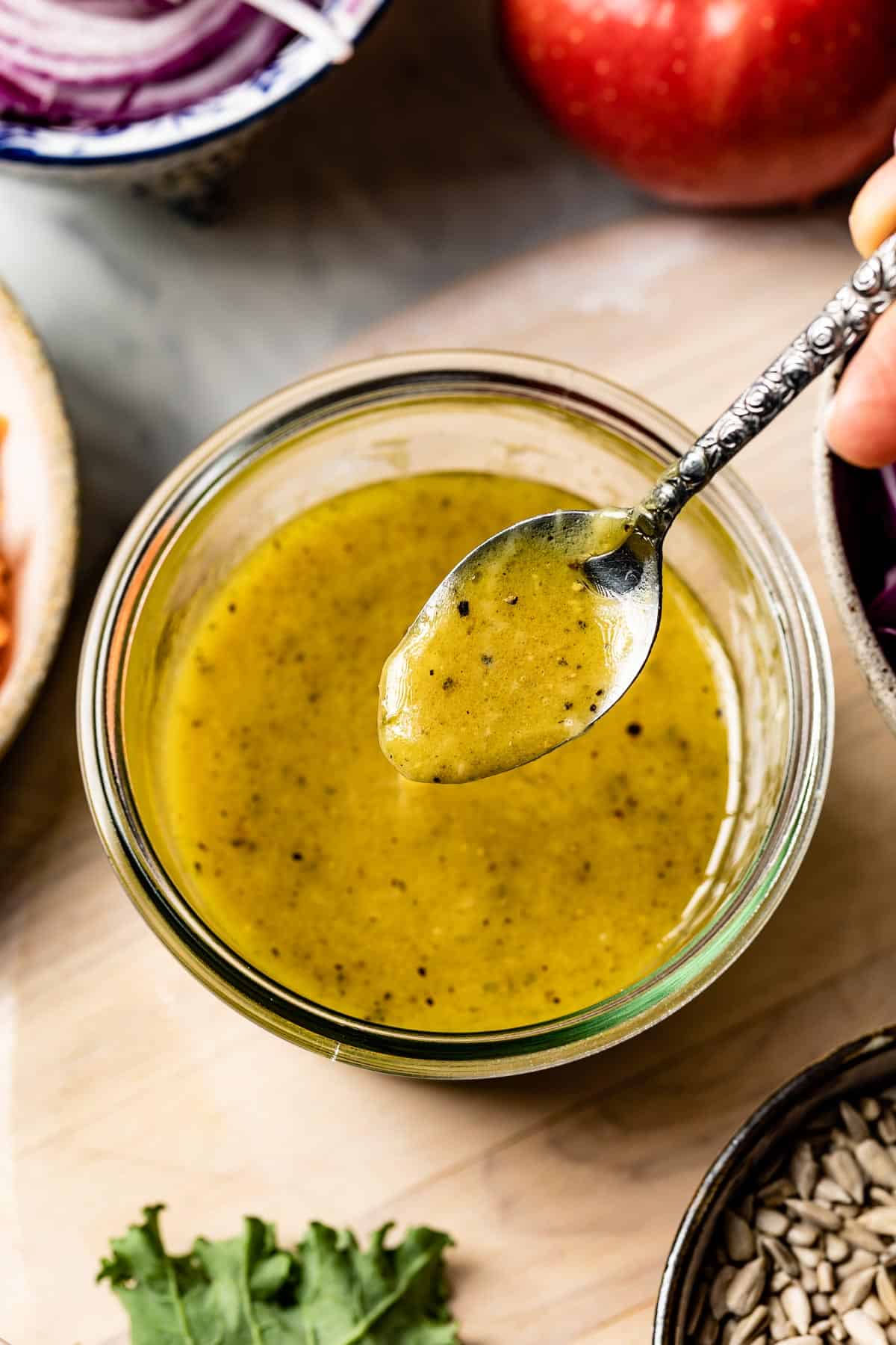 Spoon of Maple-Dijon Vinaigrette in a jar