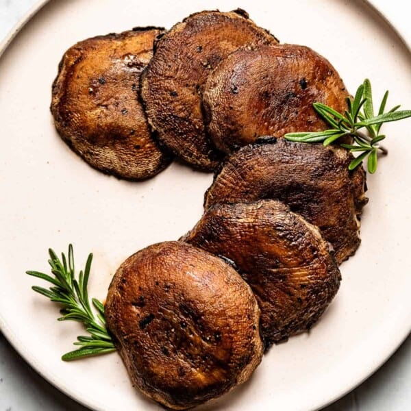 Roasted Portobello Mushrooms on a Plate garnished with rosemary