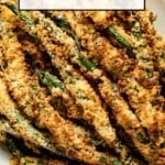 green bean fries in air fryer on a plate with text on the image