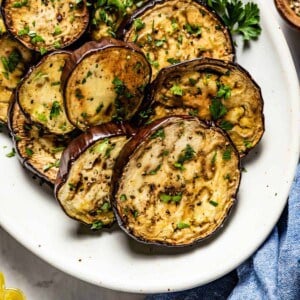 Baked Eggplant Slices on a plate from top view