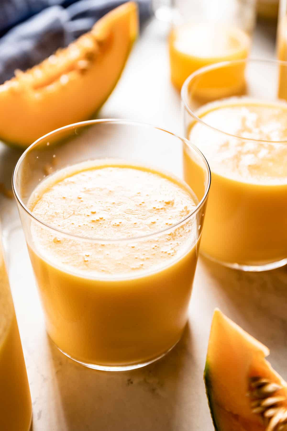 Frozen cantaloupe smoothie in a glass from close up