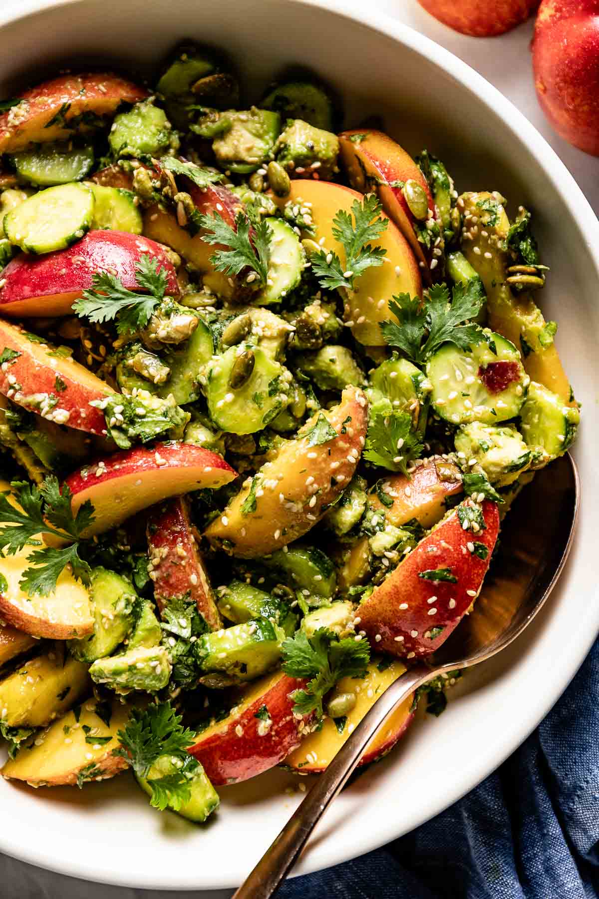 peach avocado salad recipe in a bowl