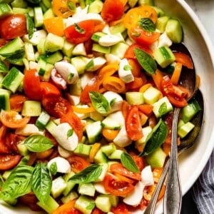 A bowl of tomato cucumber salad from the top view.