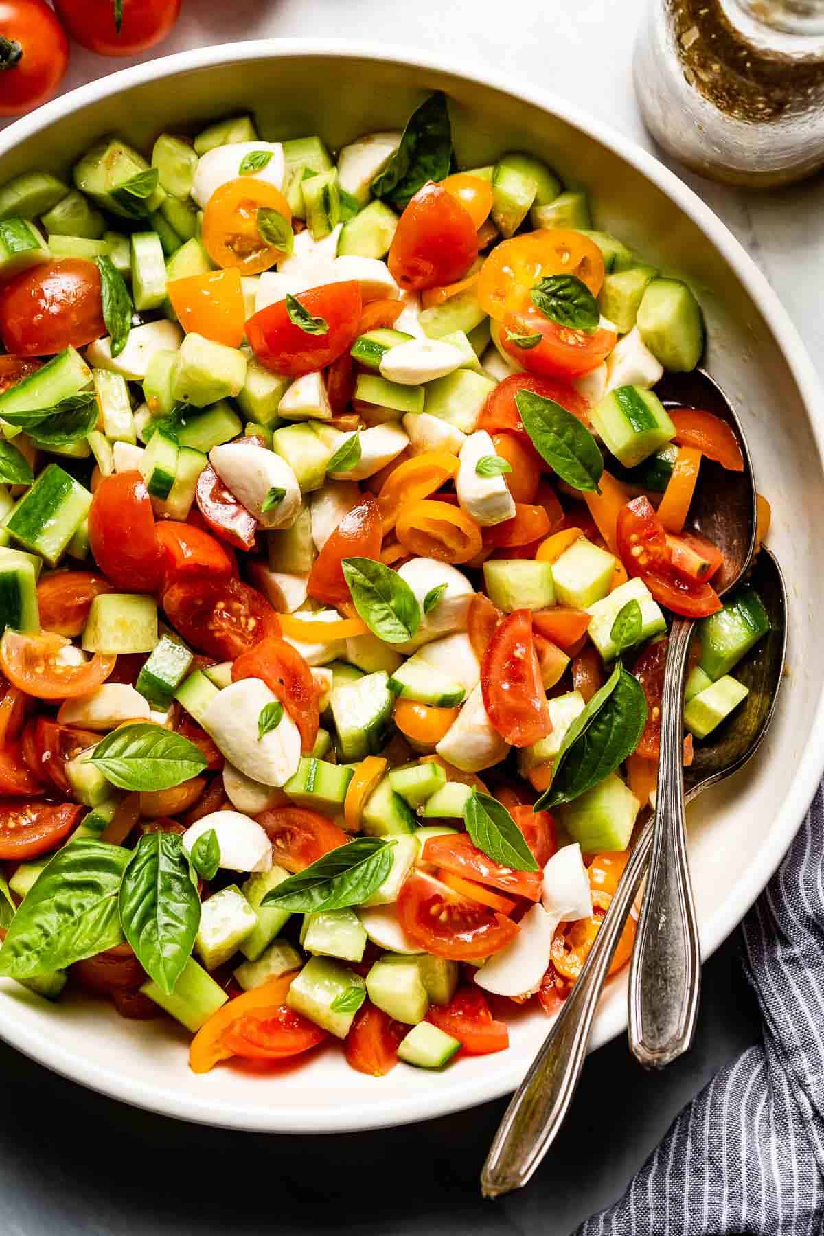 Cold summer tomato salad with mozzarella and cucumber