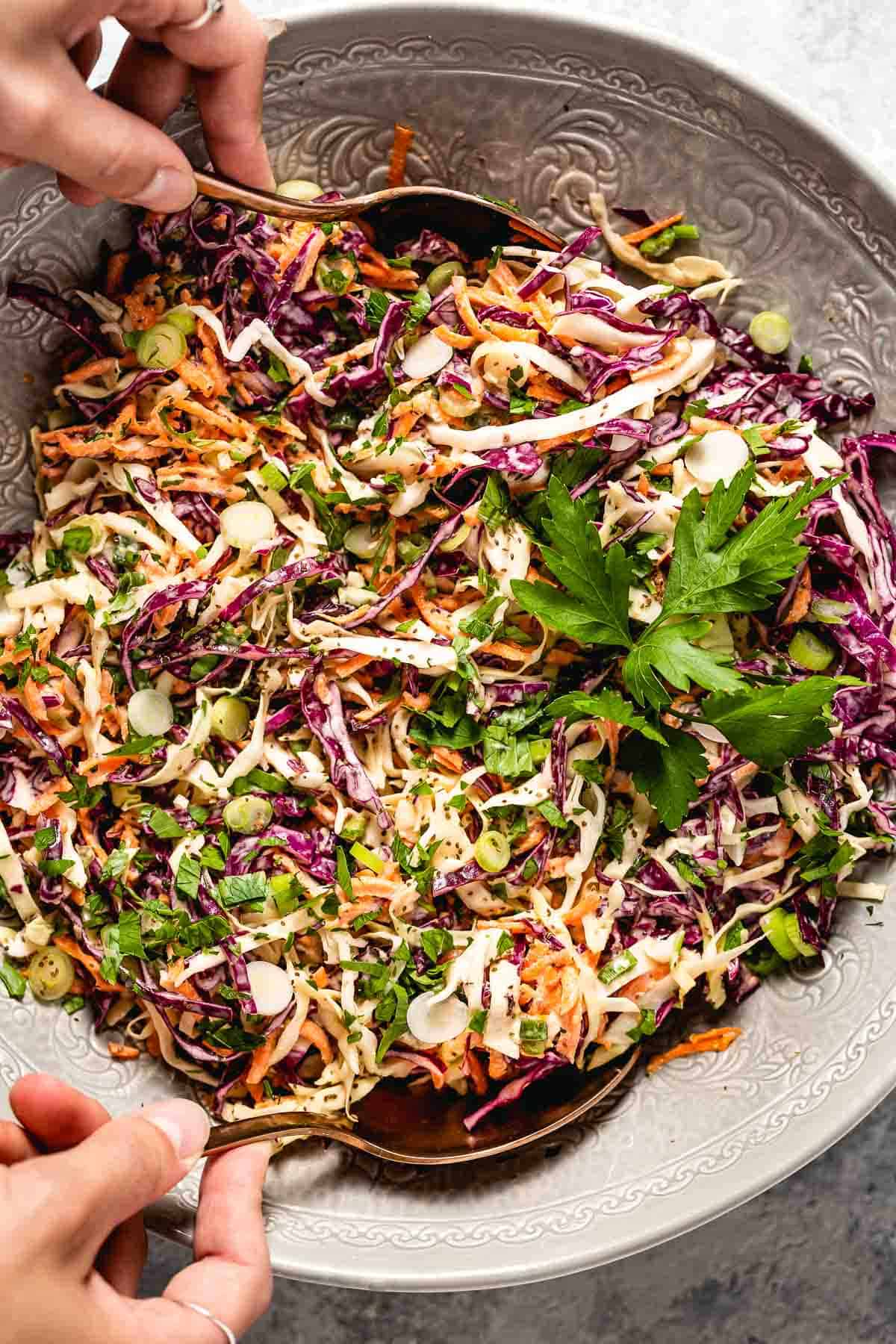 Yogurt coleslaw is being served as a chilled summer salad