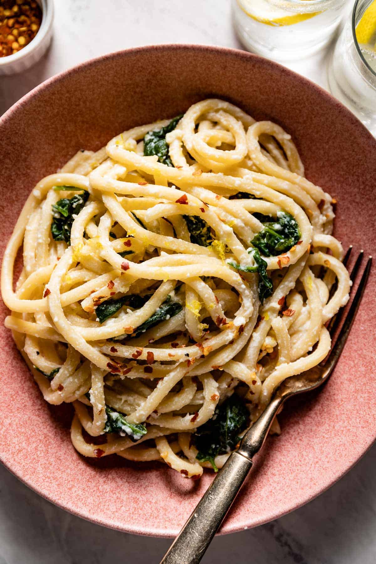 Ricotta Lemon Pasta with spinach in a bowl from the top view