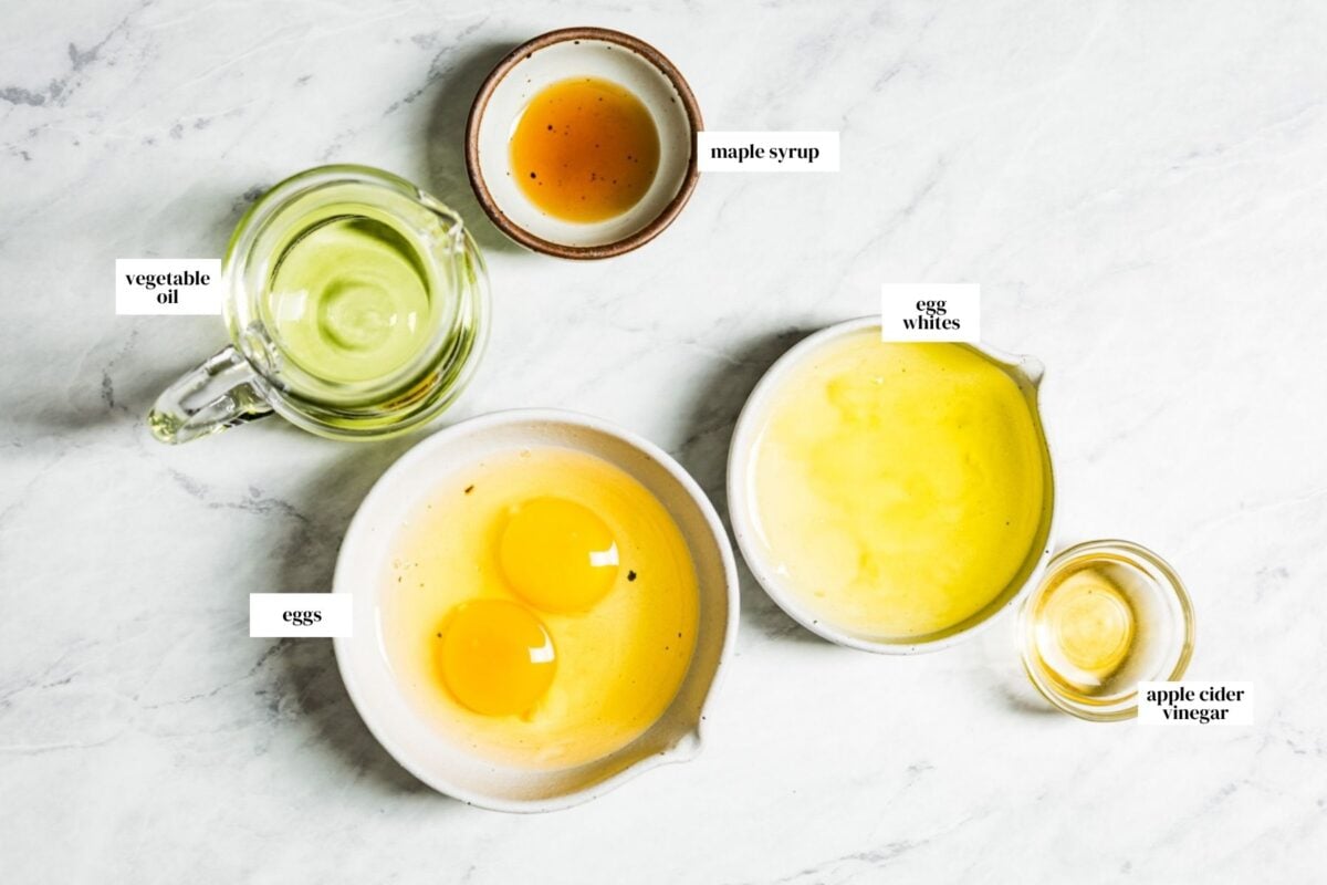 The wet ingredients, including eggs oil and maple syrup are from the top view.
