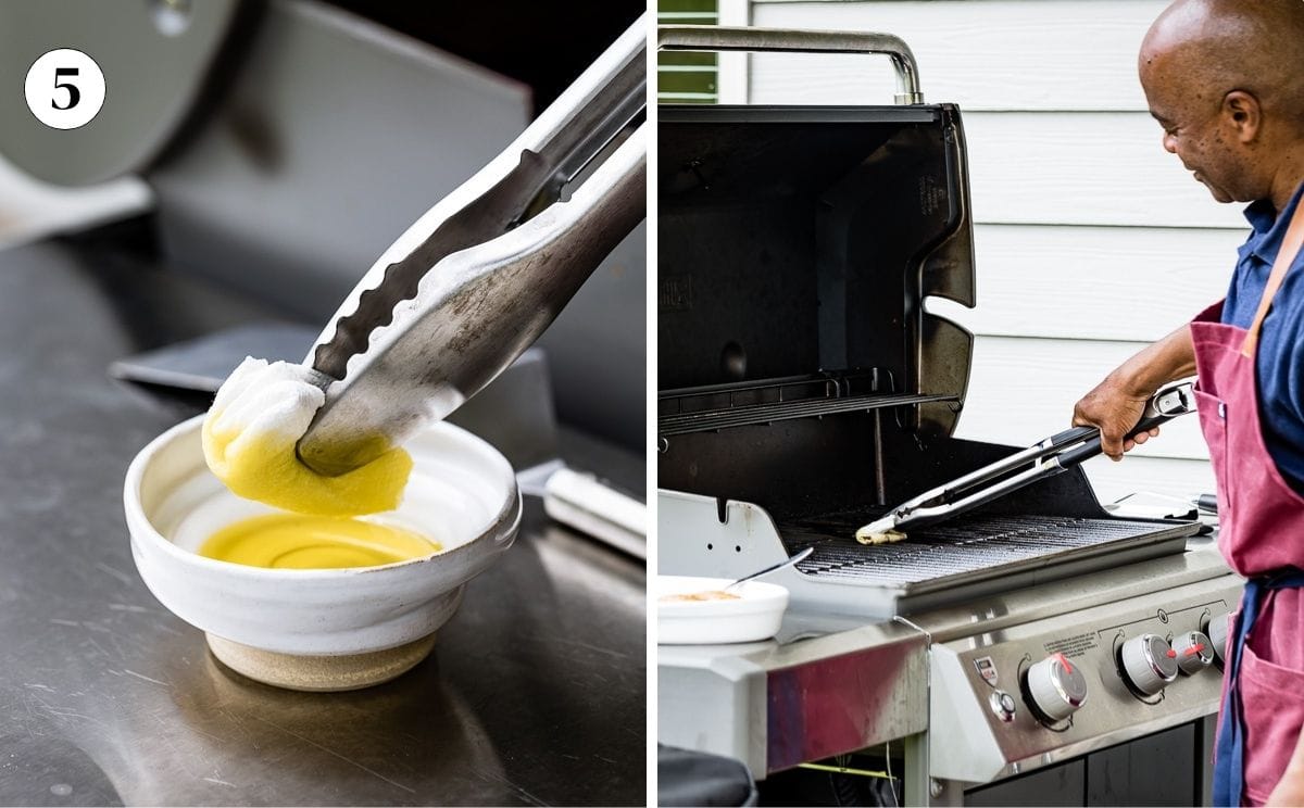 Person soaking paper towel in olive oil and then scraping the grill grates with it.