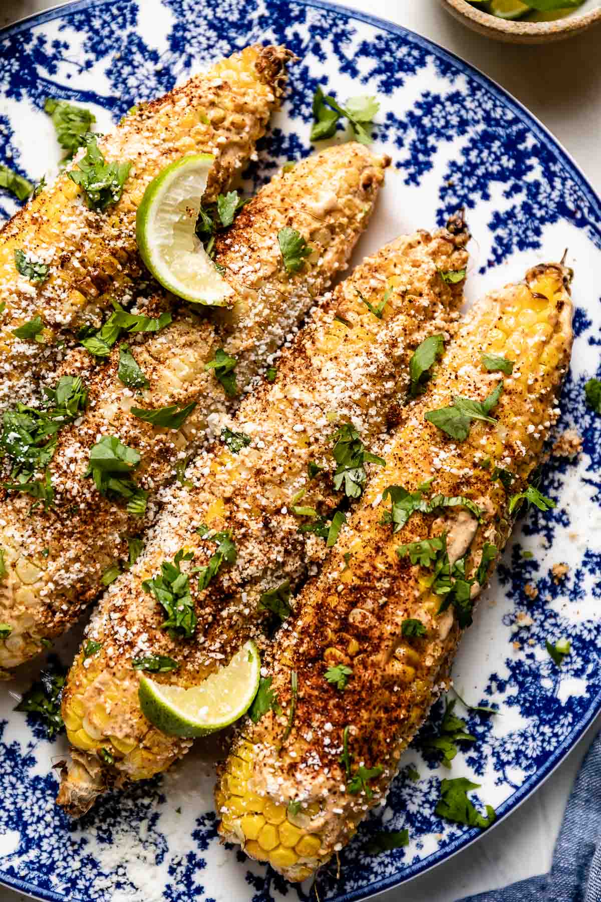 air fryer Mexican street corn on a plate from the top view