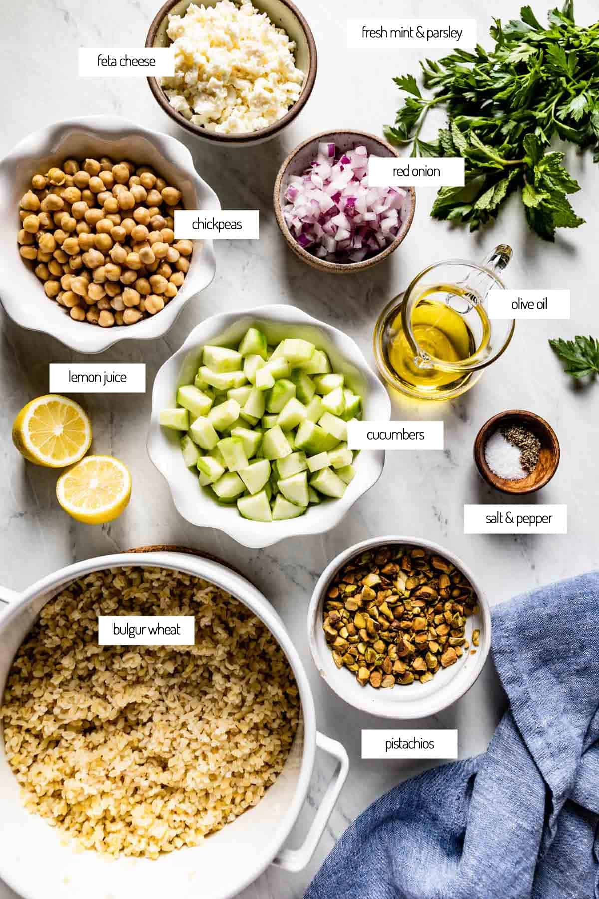 Ingredients for bulgur salad in bowls from the top view. 