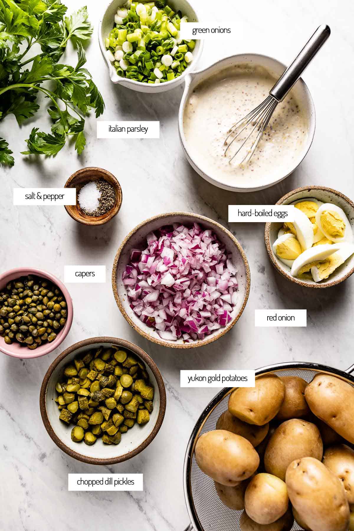 ingredients for lemon potato salad in bowls from the top view