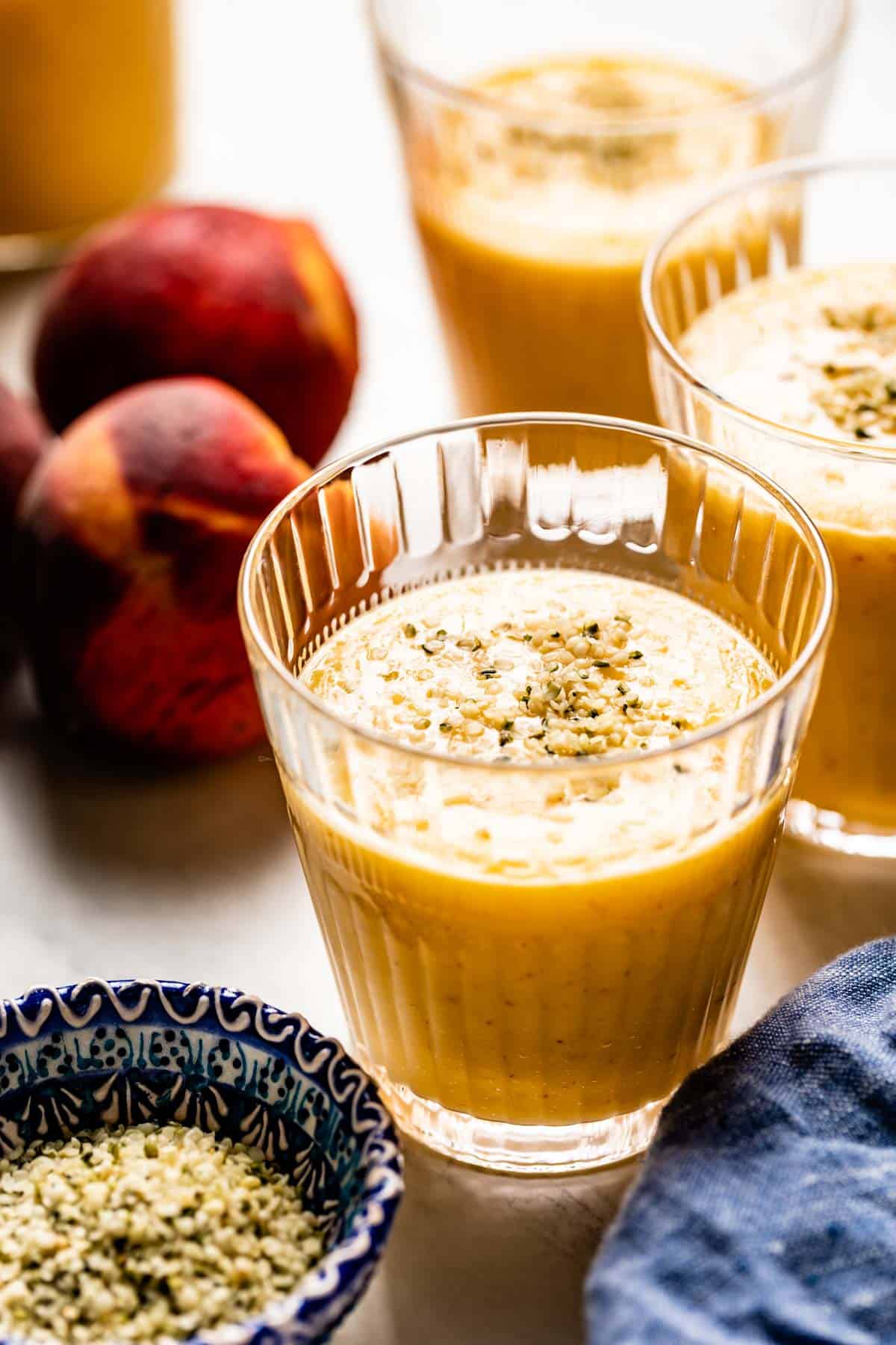 Peach Mango Milkshake in a glass from the front view. 