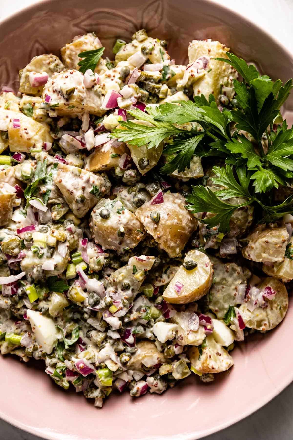 potato salad recipe with capers on a plate from the top view