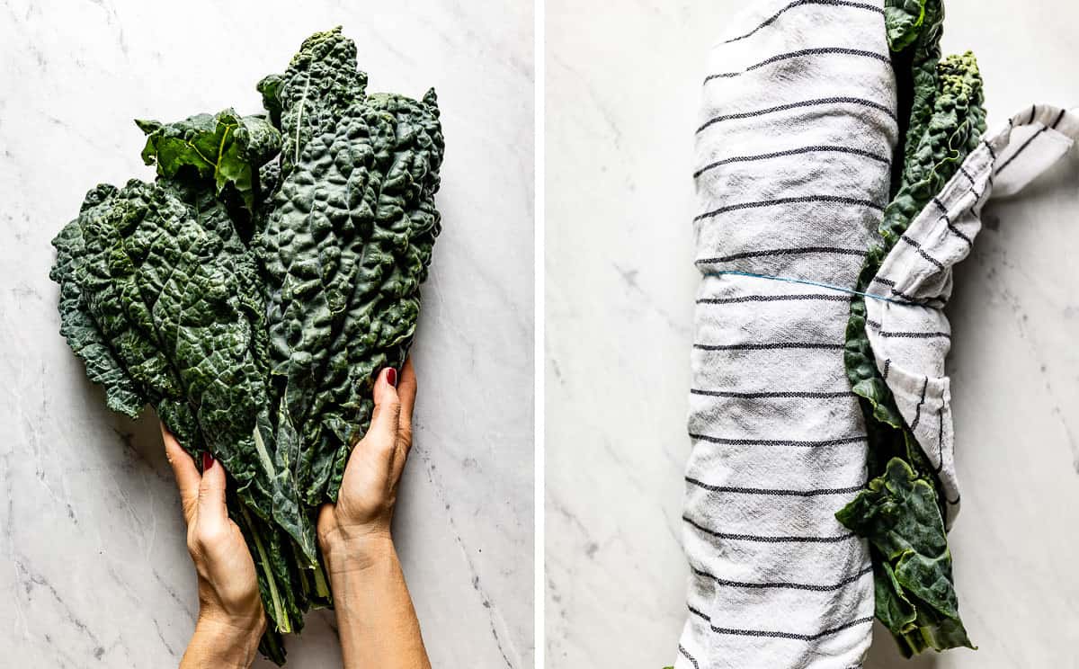 A person wrapping fresh kale in a kitchen towel from the top view.