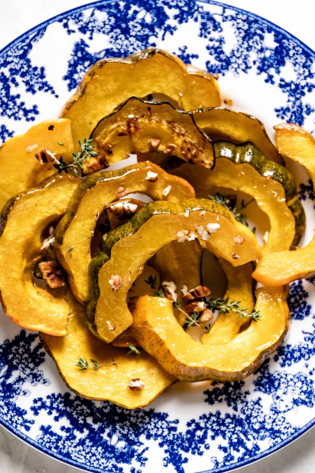 A plate of squash that has been roasted in the oven shown from the top view.