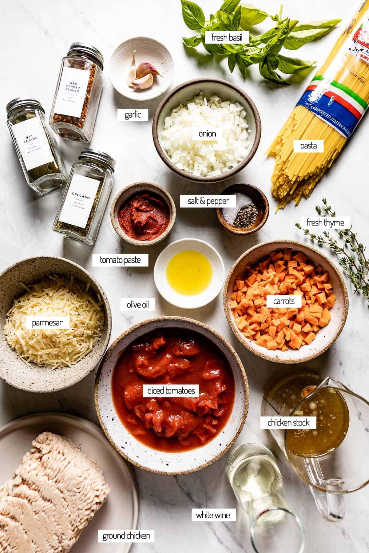 Ingredients for pasta with a tomato-based sauce from the top view.