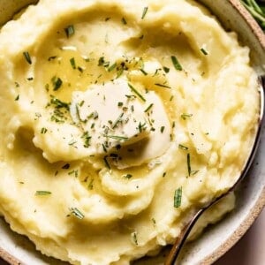 Rosemary mashed potatoes with butter on top.