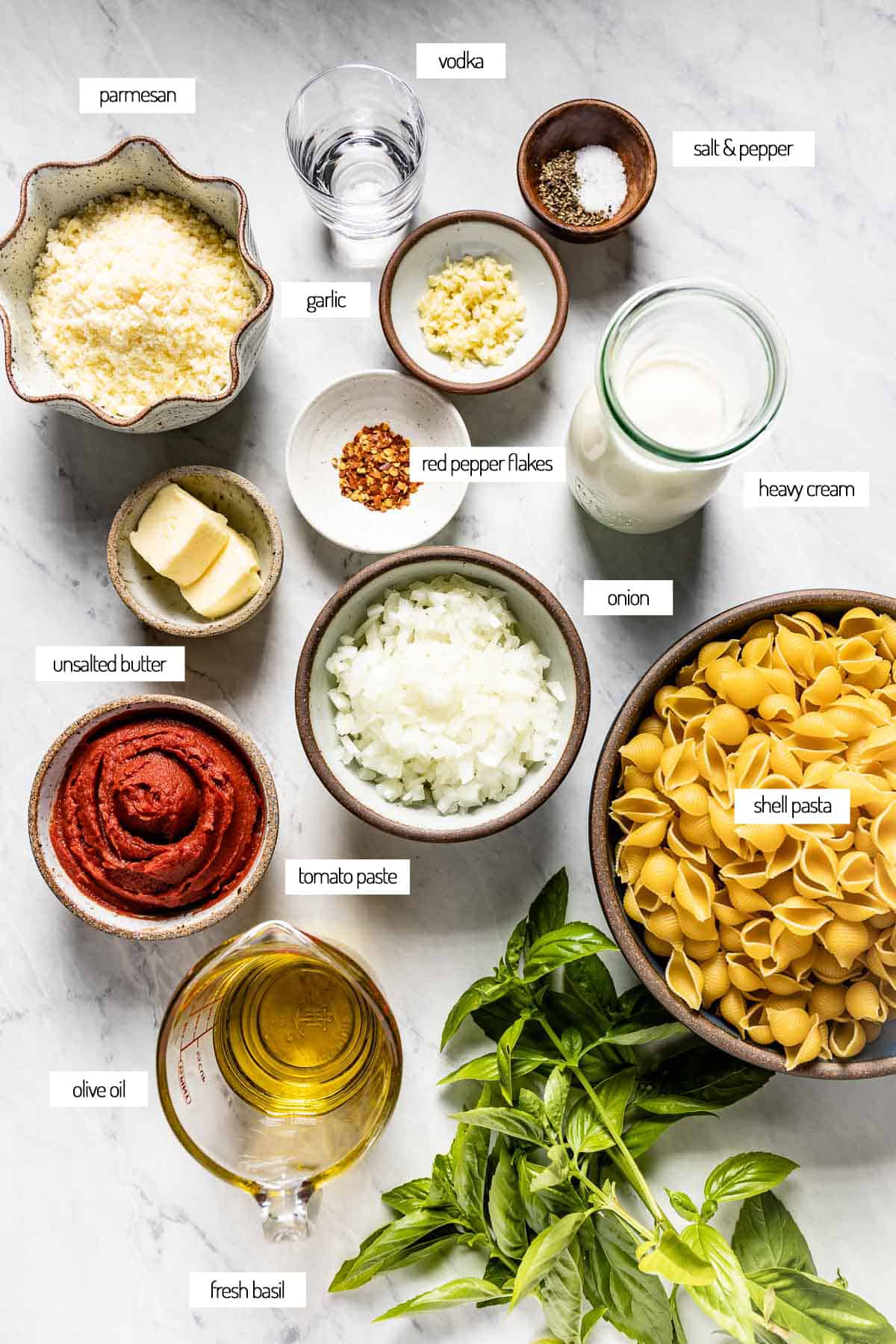 Ingredients for a pasta with spicy vodka sauce from the top view.