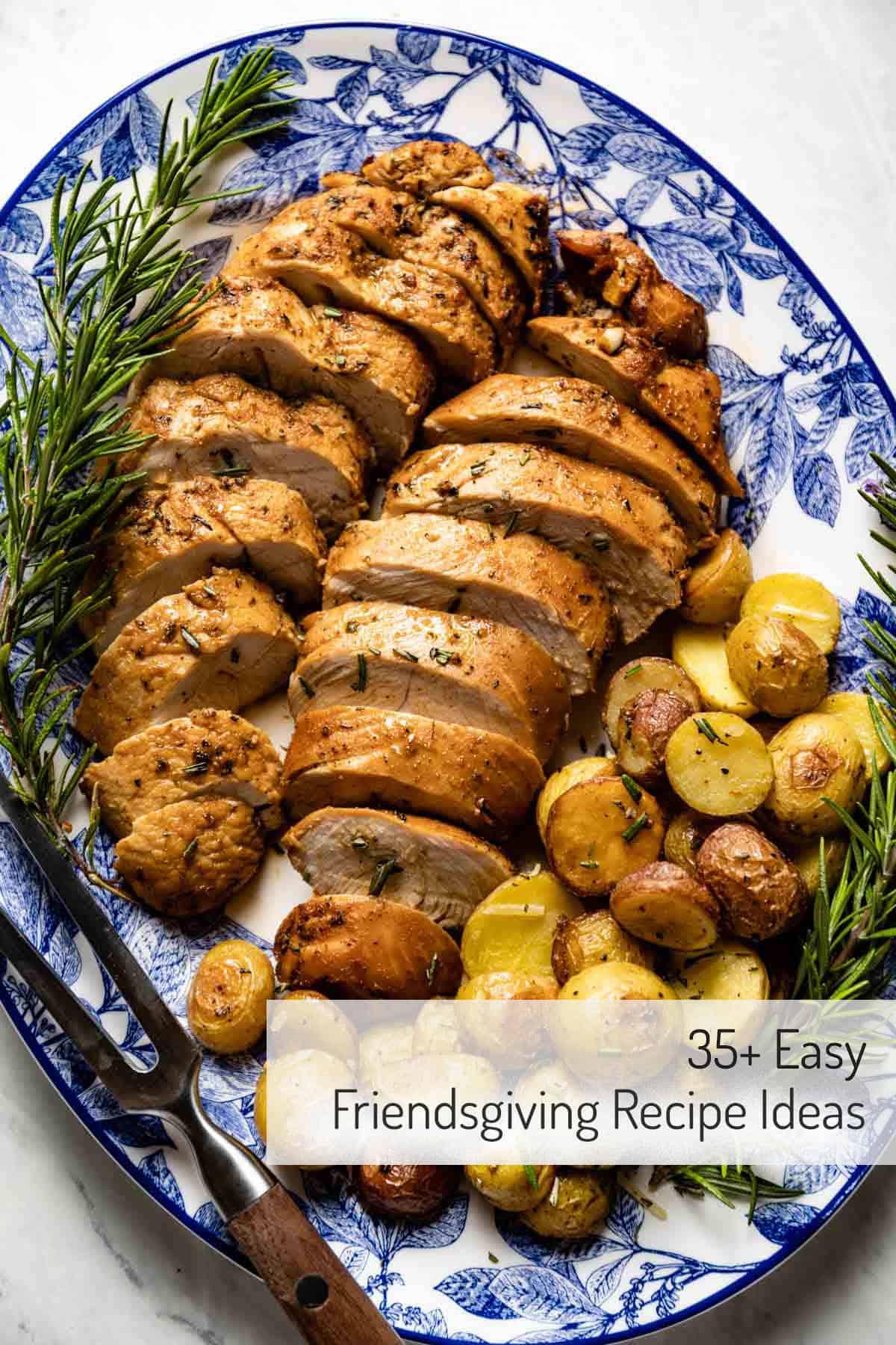 Turkey tenderloin with roasted potatoes and rosemary leaves on the side.