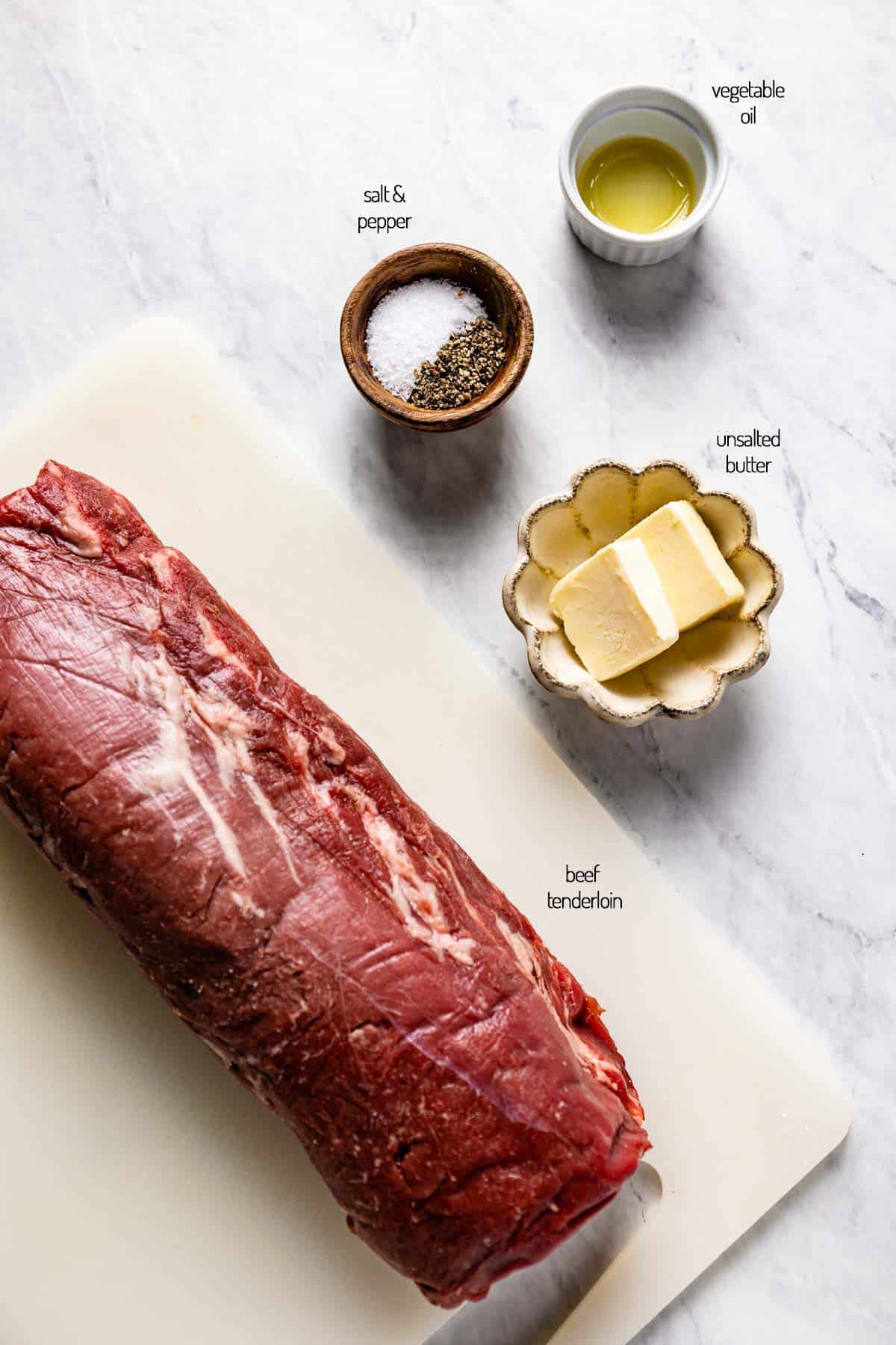 Ingredients including chateaubriand, butter and seasoning from the top view.