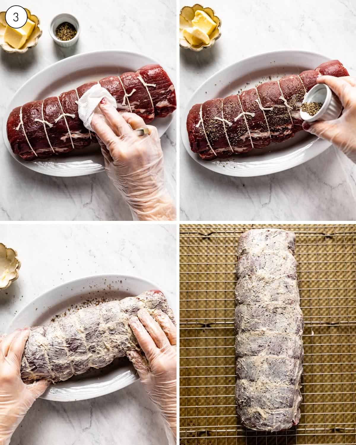 A person rubbing seasonings and butter on a cut of beef from the top view.