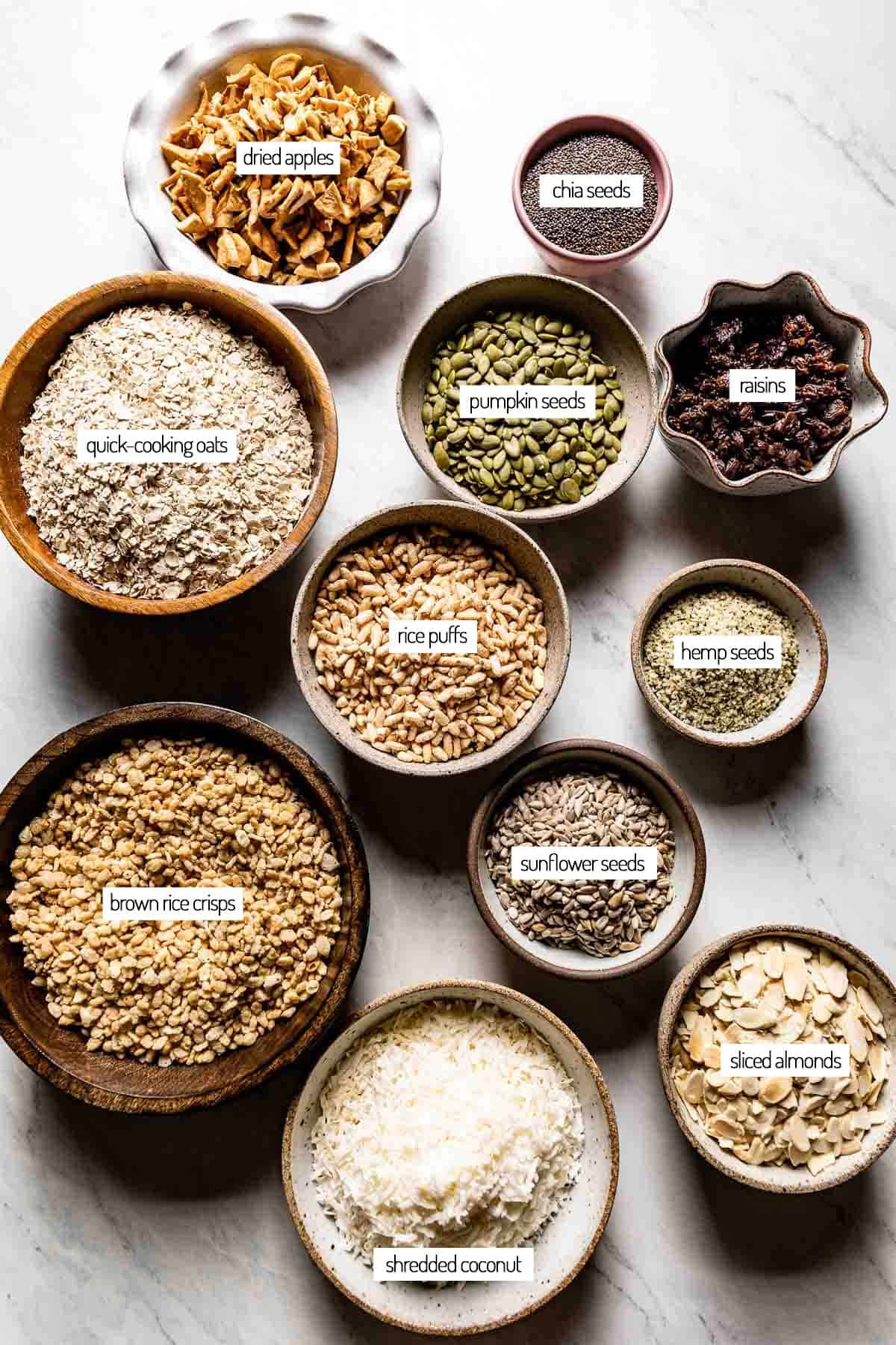 Ingredients for a homemade cereal in bowls from the top view.
