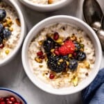 Oatmeal with yogurt in bowls with fruit from the top view.
