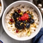 Refrigerator oats with yogurt in a bowl with fruit from the top view.