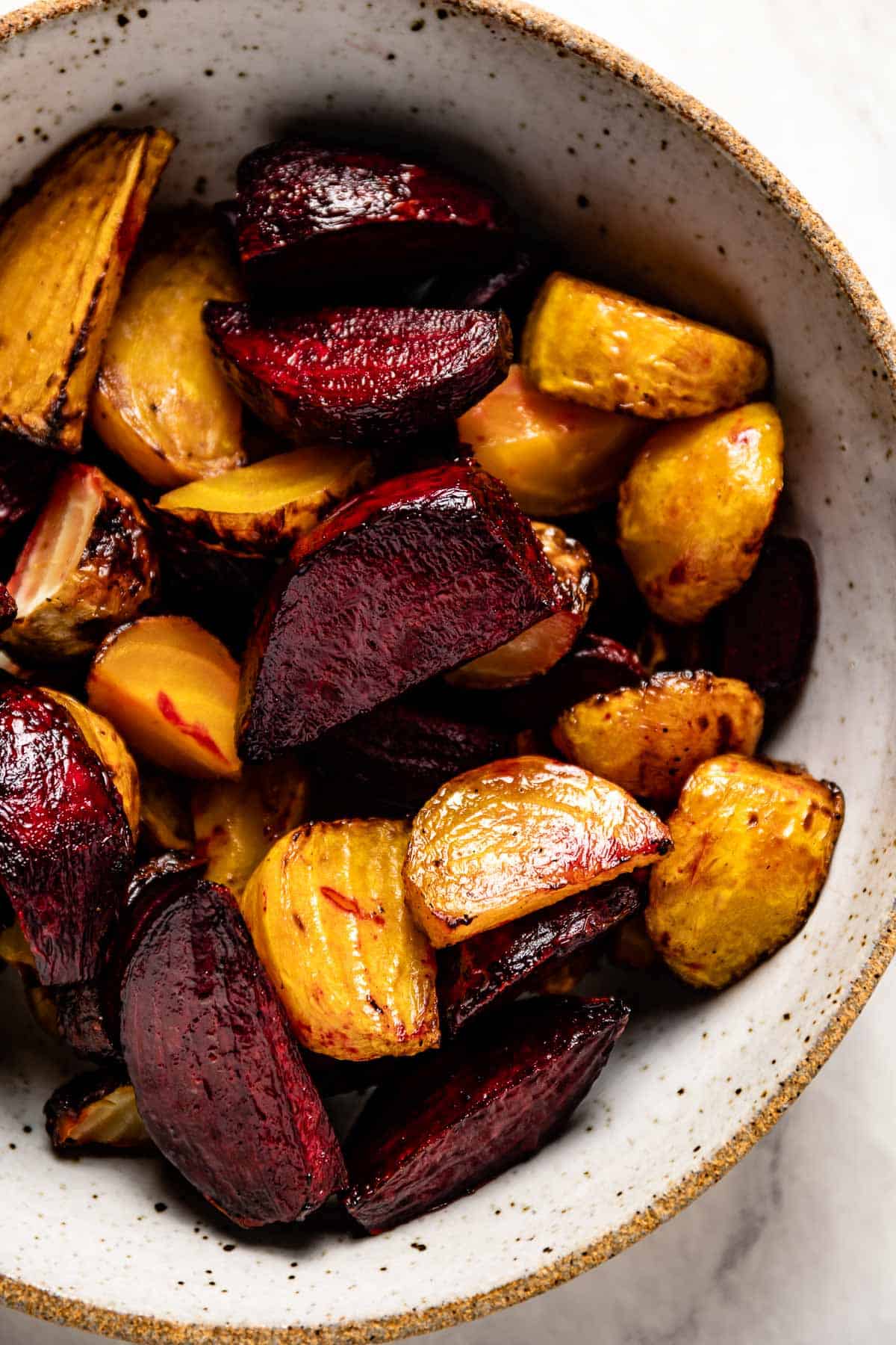 Roasted beetroot in air fryer served in a bowl shown from the top view. 