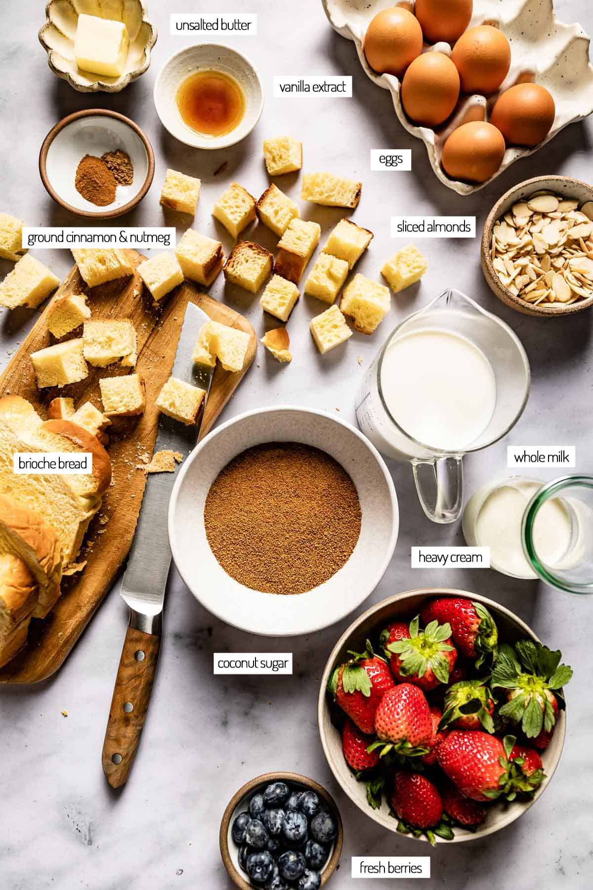 Ingredients for a casserole made with brioche bread shown from the top view.