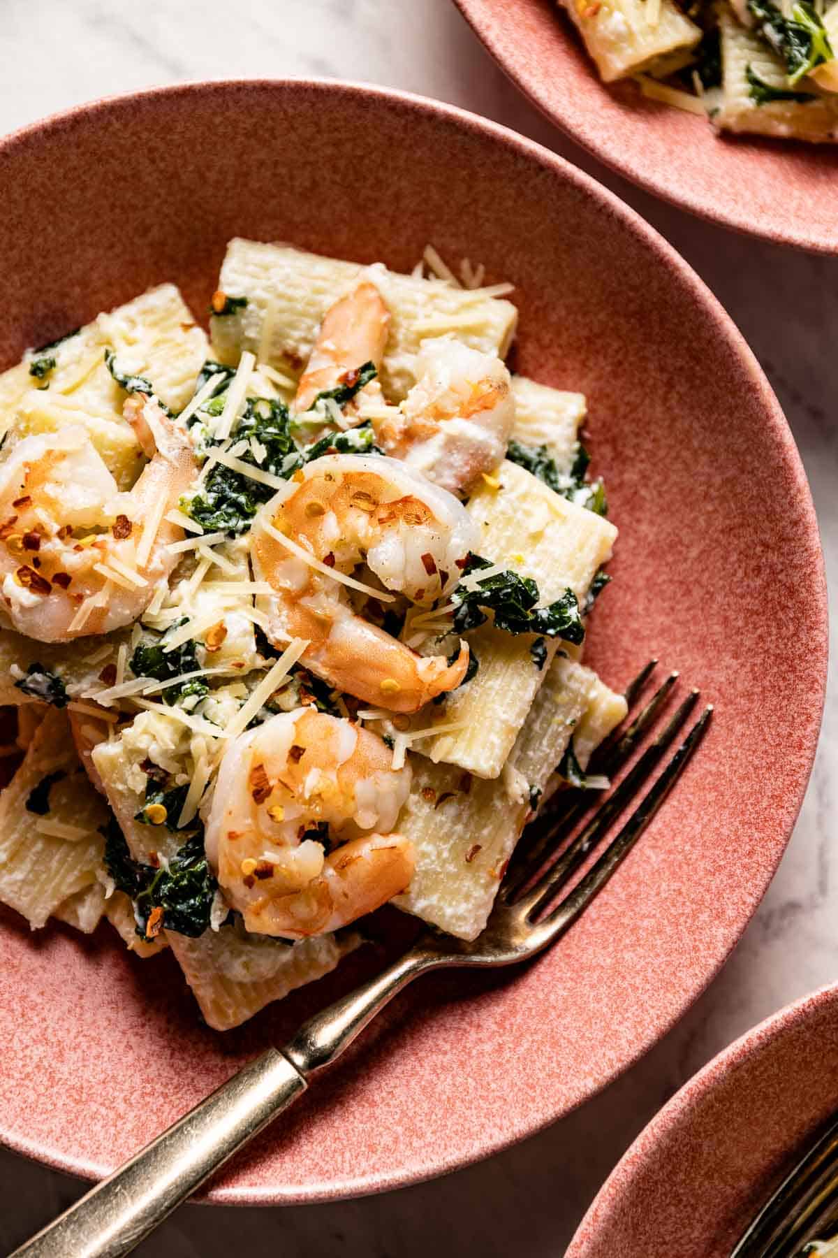 Ricotta Shrimp pasta in a bowl with a fork on the side.