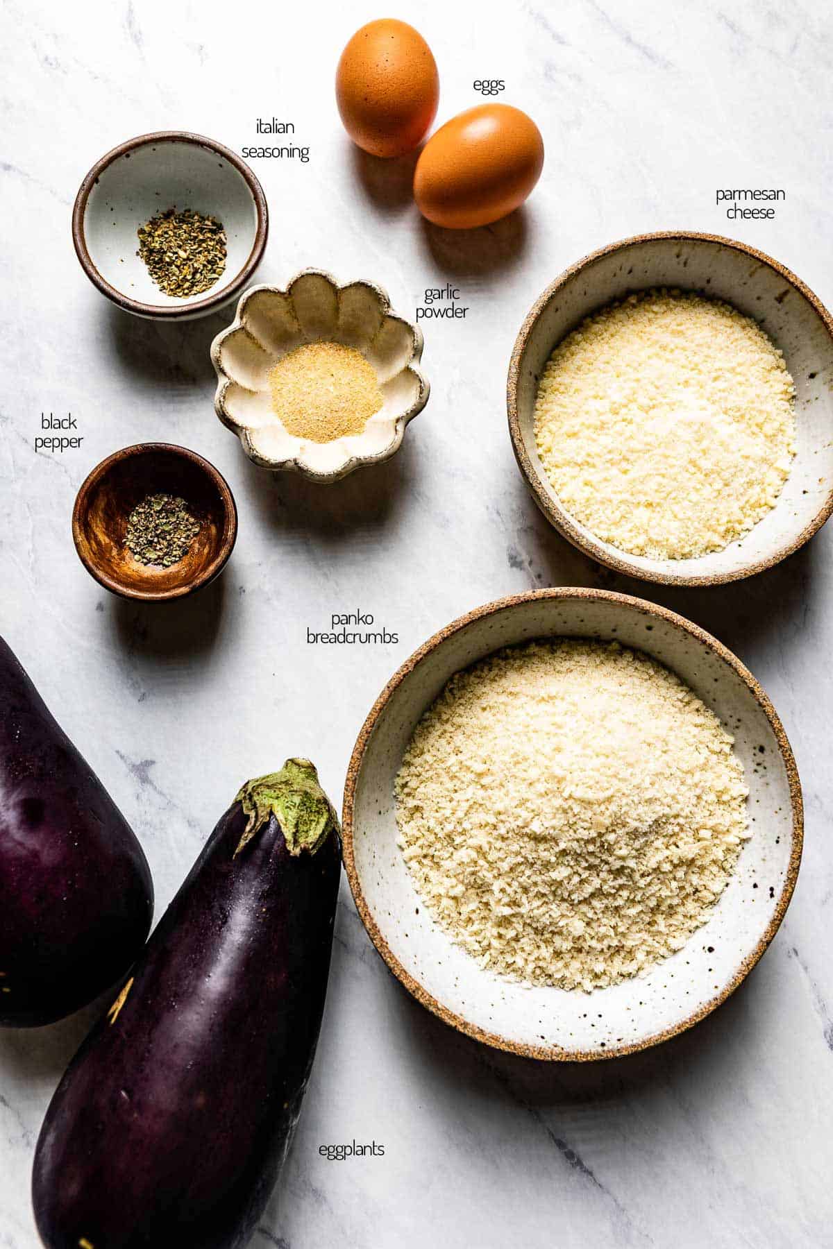 Ingredients for crispy slices of eggplant with breadcrumbs.