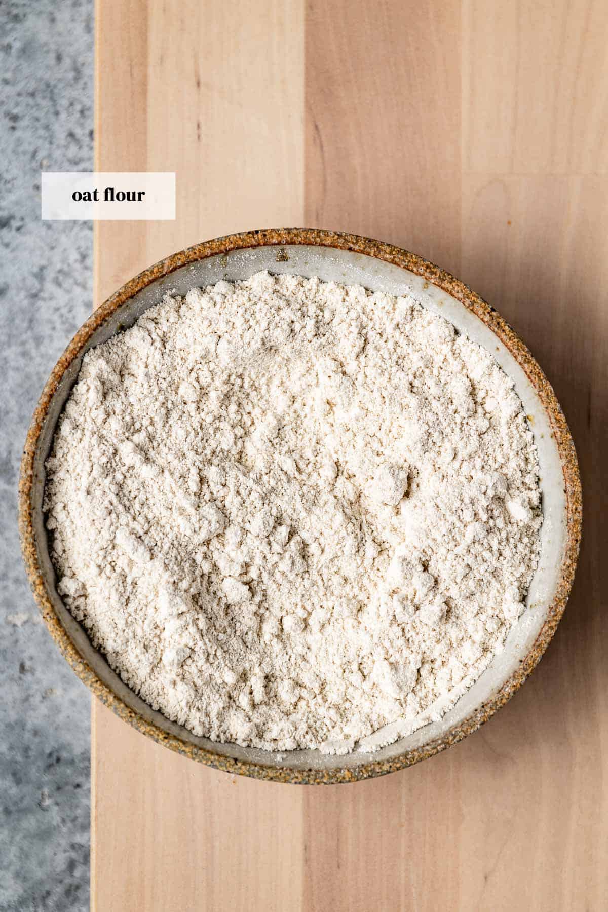 Oat flour in a bowl from the top view.