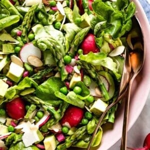 Spring green salad recipe in a bowl from the top view.