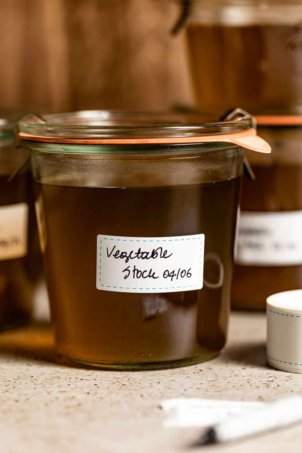 Veg stock stored and labeled in jars.