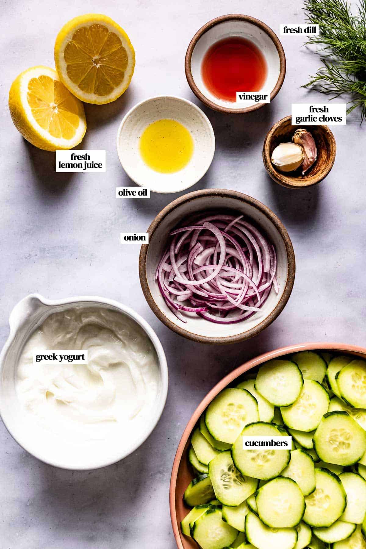 Ingredients for cucumber yogurt salad recipe from the top view.