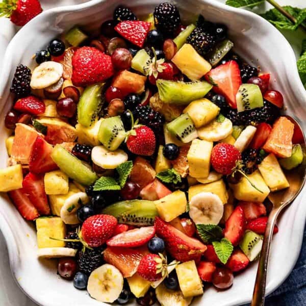 Breakfast fruit salad in a bowl from the top view.