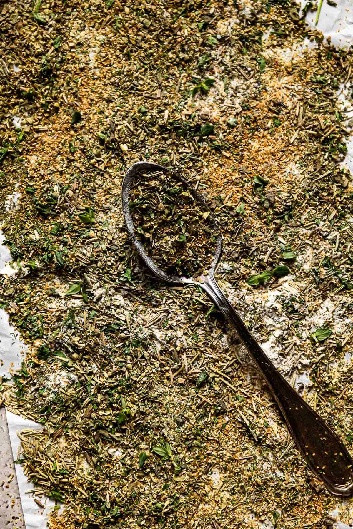 Mediterranean seasoning with a spoon from the top view.