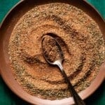 Blackened chicken seasoning recipe on a plate with a spoon.