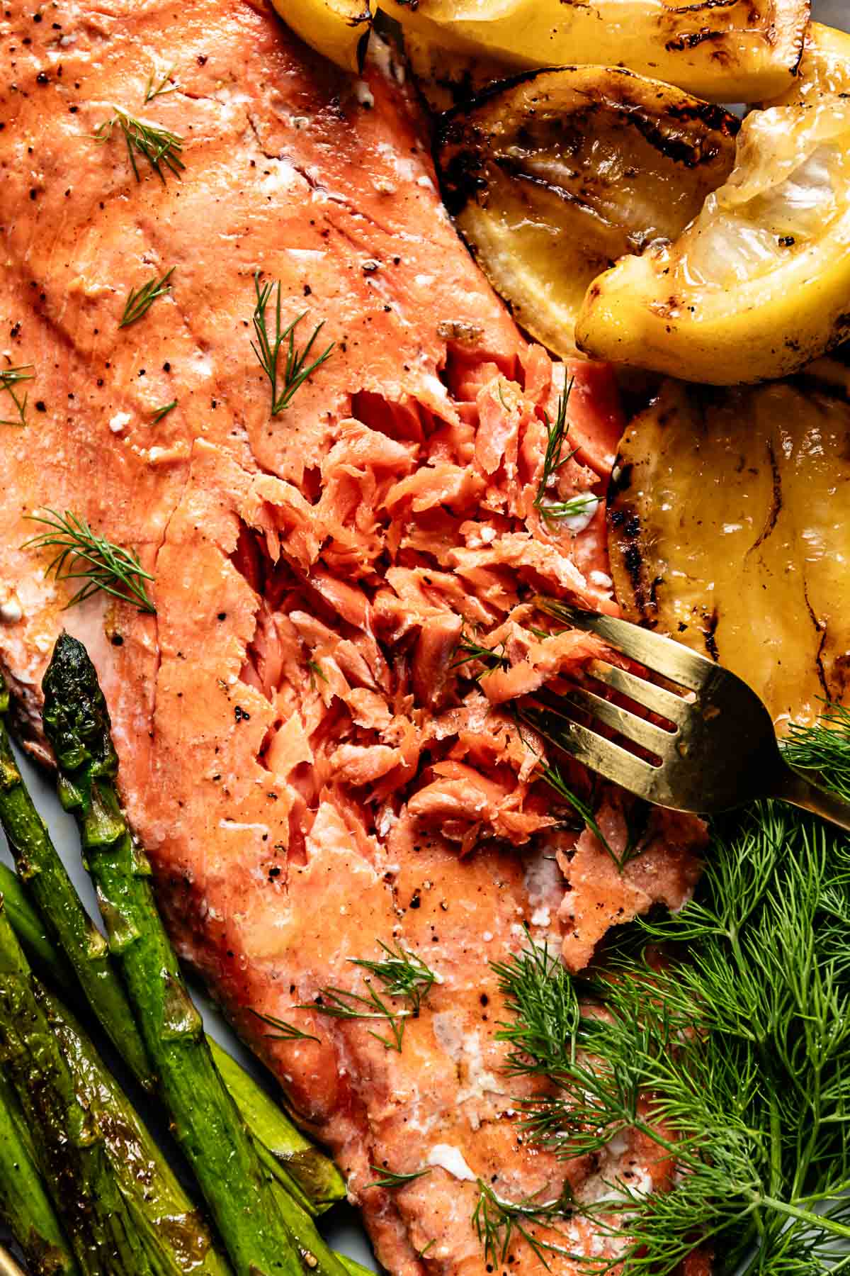 Flaked grilled Sockeye salmon garnished with lemon.