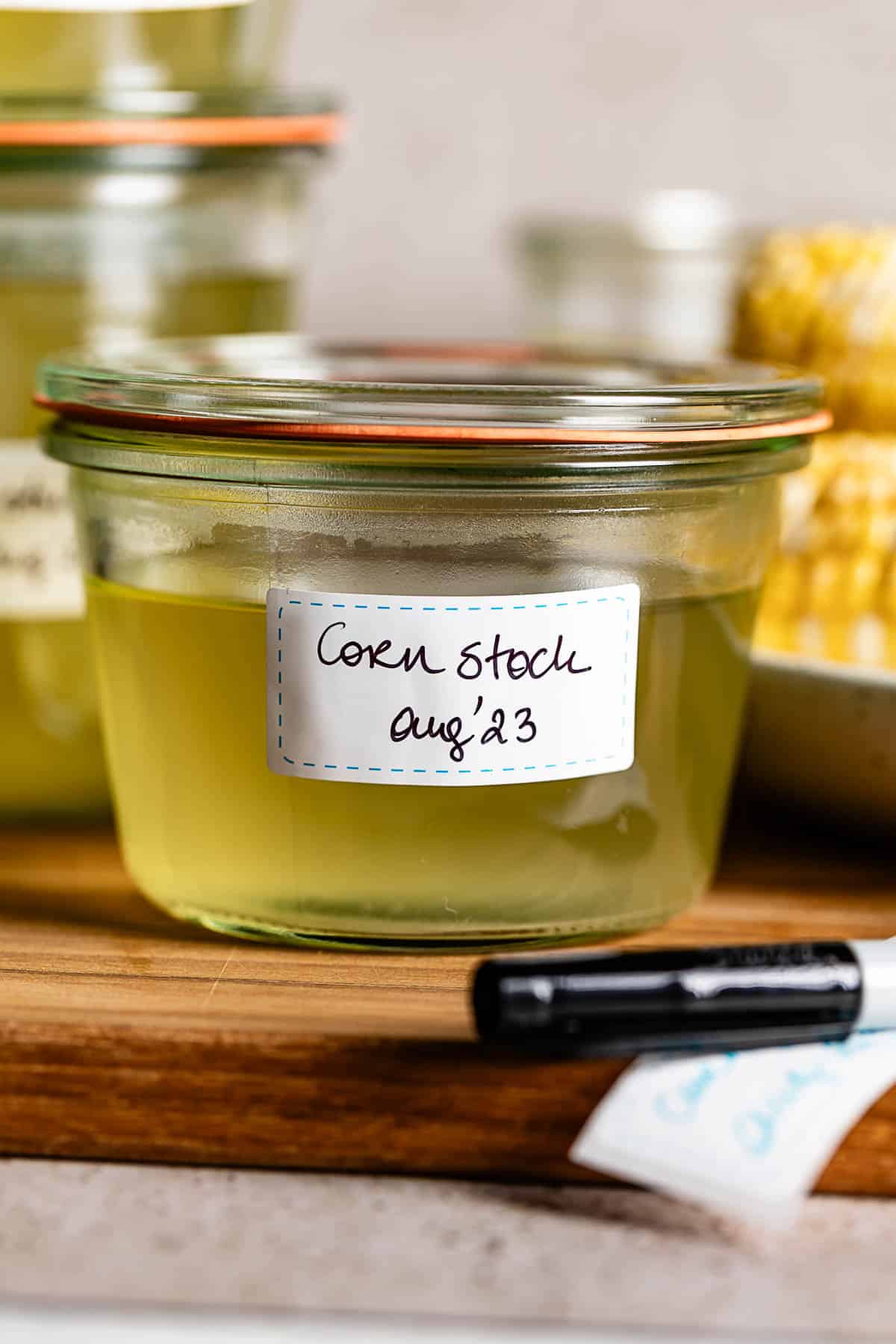 Corn cob soup stock in a jar dated and labeled.