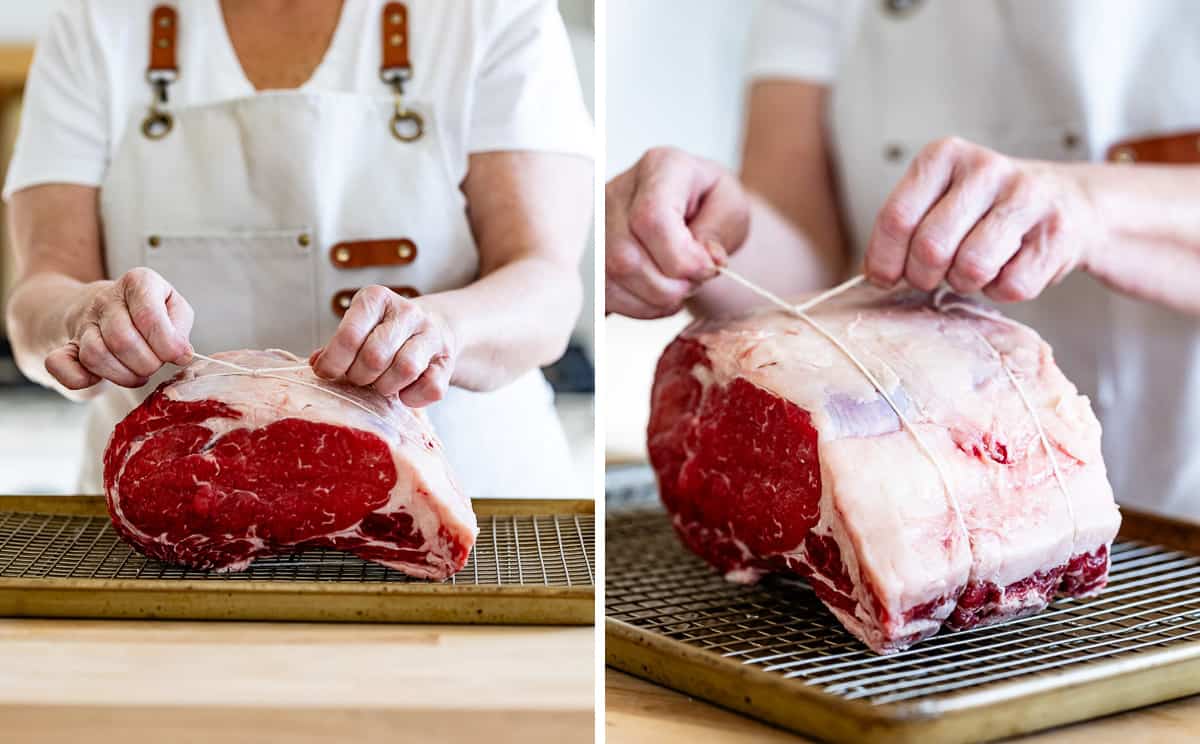 Person tying a standing rib roast with kitchen twine.