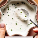 Beef tenderloin horseradish cream sauce in a bowl with text on the image.