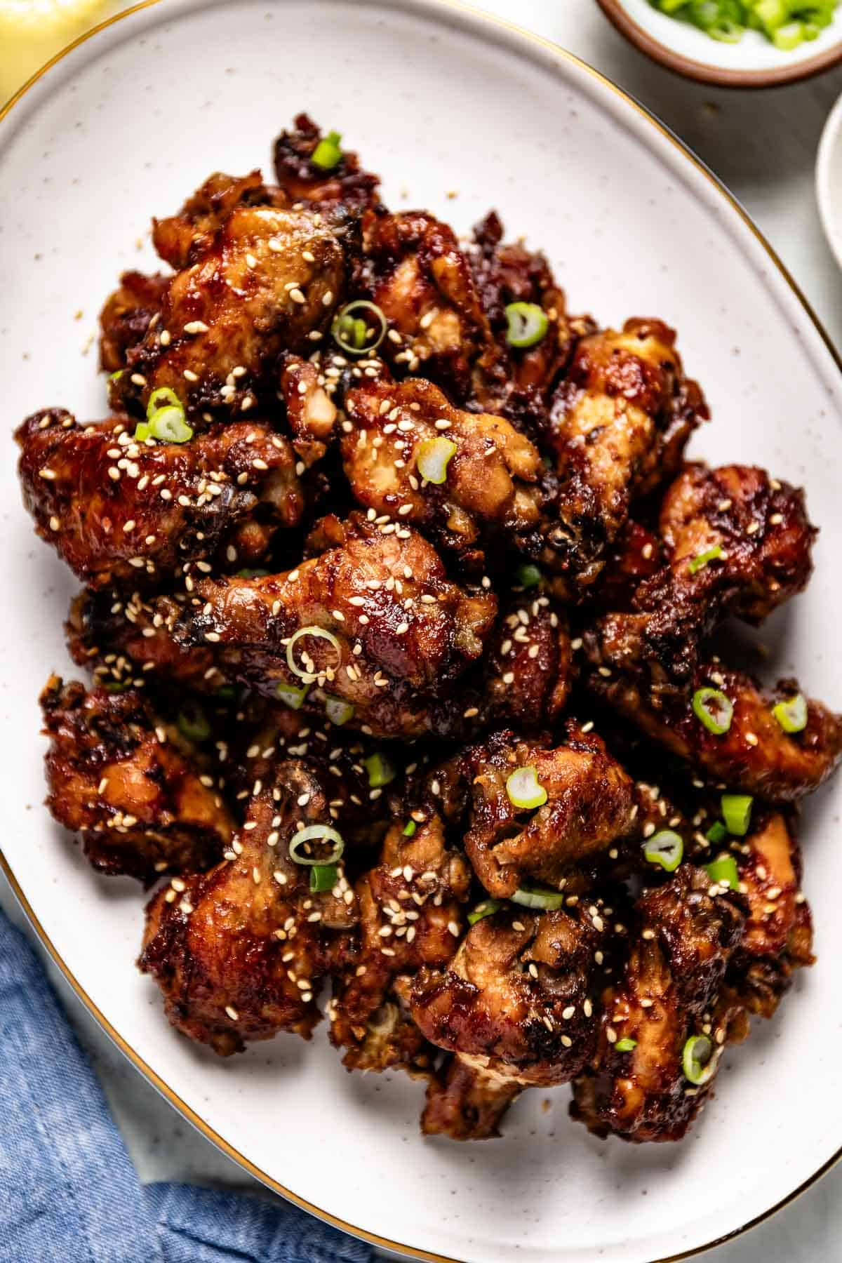 Slow Cooker Asian Chicken Wings on a plate from the top view.