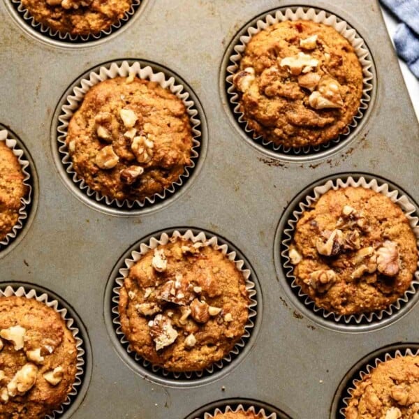 Almond flour carrot muffins fresh out of the oven in a muffin tin.