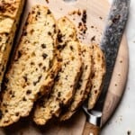 Barefoot Contessa's Irish Soda Bread sliced with a knife on the side.